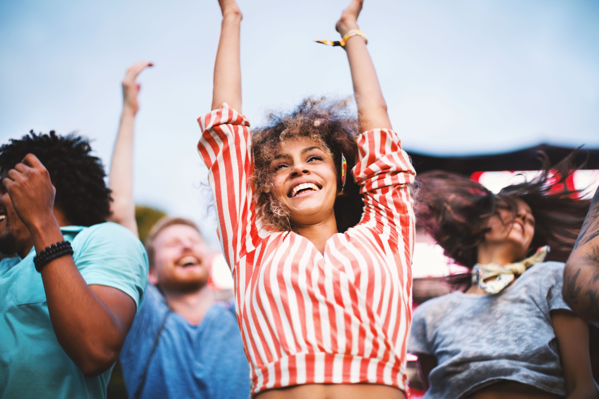 People dancing at concert.